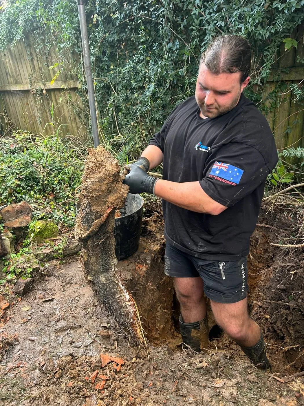 Pulling tree roots out of a blocked sewer line