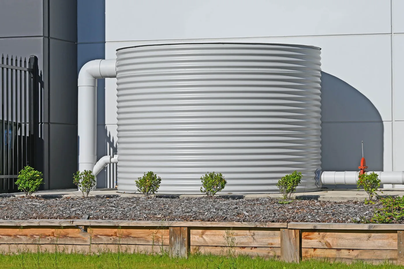 Rainwater tank installed beside a commercial building