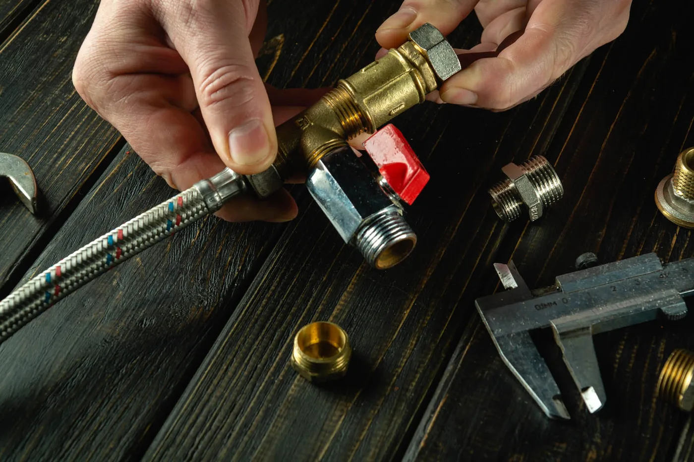 Assembling a gas fitting with a valve and braided line