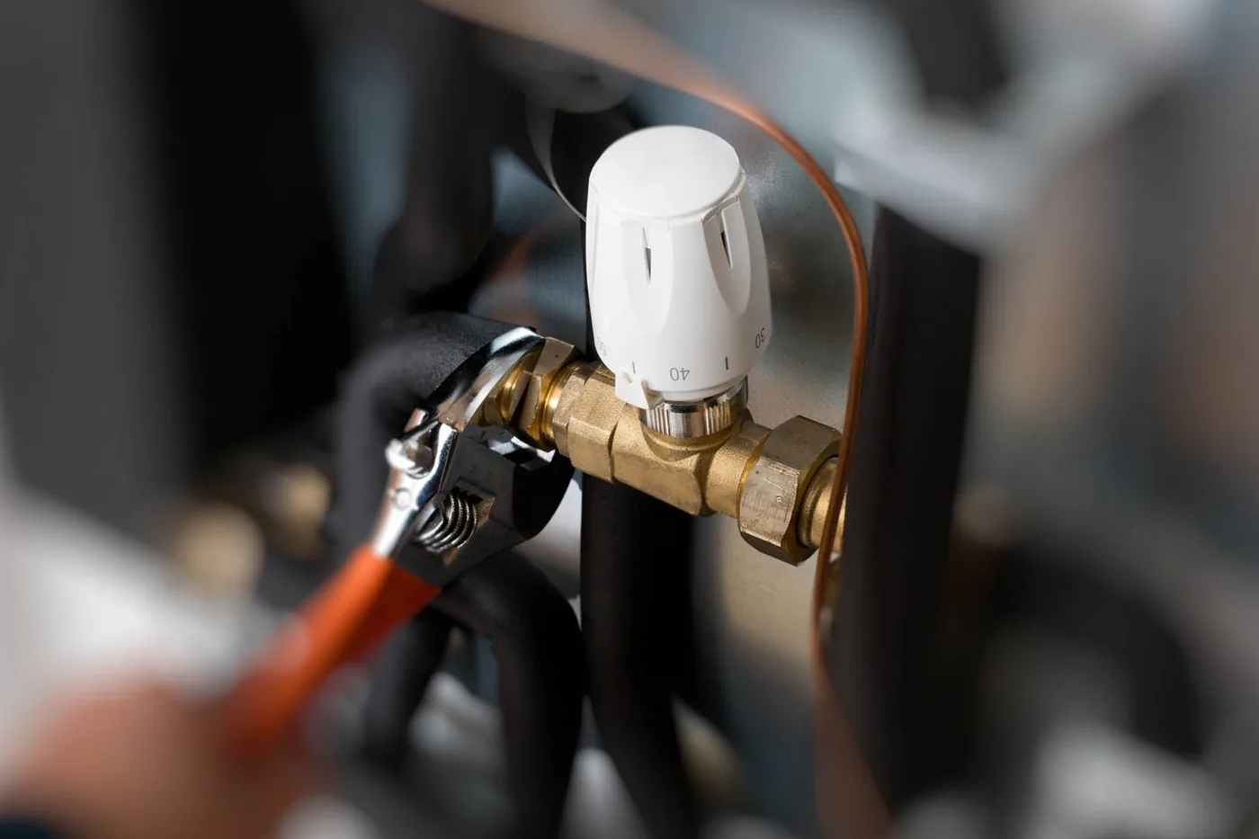 Repairing the gas valve on a hot water unit