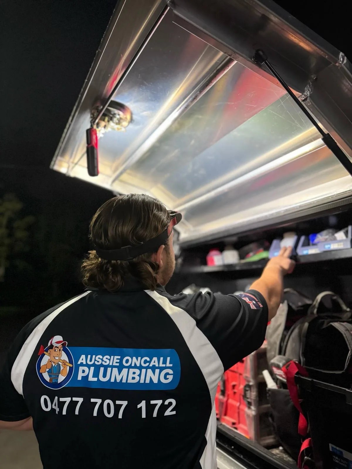 Grabbing gear from the service van on a night call-out
